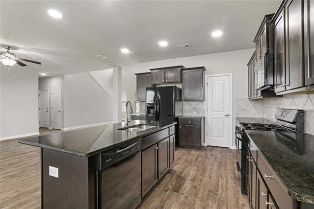 693 Lakeshore Village Dr, Slidell, LA 70461 - kitchen with black appliances, a sink, ceiling fan, wood finished floors, and recessed lighting