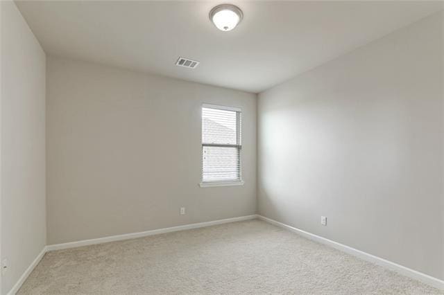 693 Lakeshore Village Dr, Slidell, LA 70461 - spare room featuring light colored carpet and baseboards