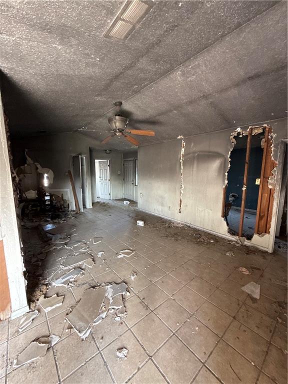16 Petit Bayou Ln, New Orleans, LA 70129 - unfurnished living room with ceiling fan