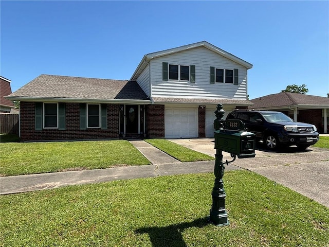 2132 Missille St, Harvey, LA 70058 - view of front facade with driveway, brick siding, a garage, and a front lawn