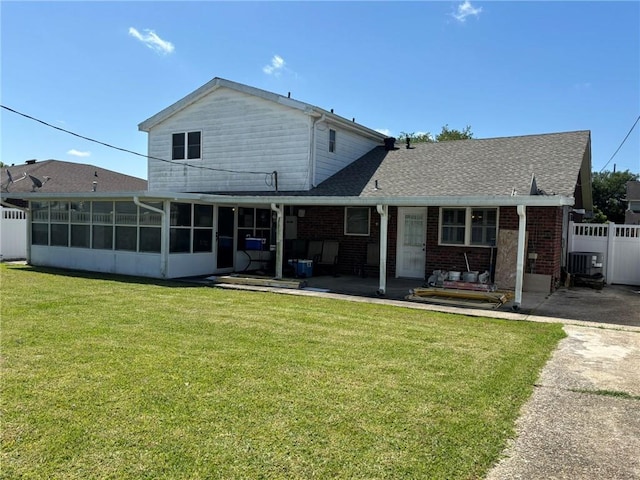2132 Missille St, Harvey, LA 70058 - back of property featuring a sunroom, brick siding, a patio, and a shingled roof