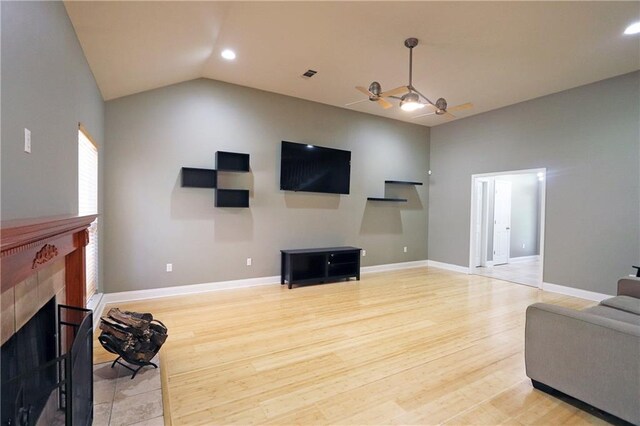 47013 Rivergate Dr, Robert, LA 70455 - living area with ceiling fan, a fireplace, light wood-style flooring, recessed lighting, and baseboards