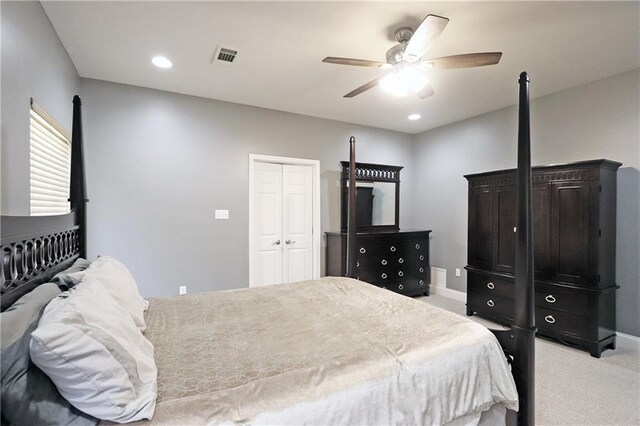 47013 Rivergate Dr, Robert, LA 70455 - bedroom with light colored carpet, ceiling fan, a closet, recessed lighting, and baseboards