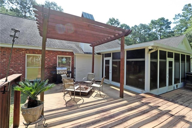 47013 Rivergate Dr, Robert, LA 70455 - wooden terrace with a sunroom, a pergola, an outdoor fire pit, and area for grilling