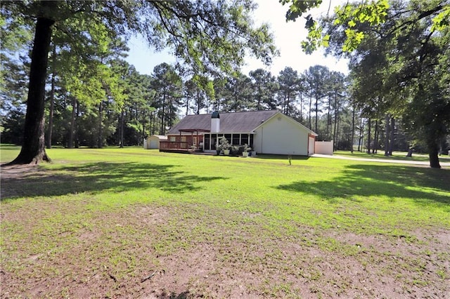 47013 Rivergate Dr, Robert, LA 70455 - view of grassy yard with view of scattered trees and a wooden deck