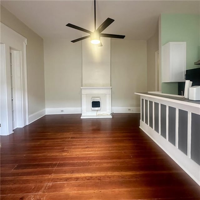 1915-1917 Bayou Rd, New Orleans, LA 70116 - unfurnished living room featuring wood finished floors, a ceiling fan, and baseboards
