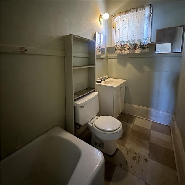 1915-1917 Bayou Rd, New Orleans, LA 70116 - full bath with a tub, toilet, vanity, and tile patterned floors