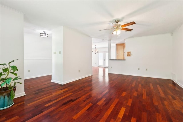 120 Pine Dr, Covington, LA 70433 - unfurnished living room with a ceiling fan, a chandelier, dark wood-type flooring, baseboards, and ornamental molding