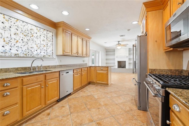 120 Pine Dr, Covington, LA 70433 - kitchen with appliances with stainless steel finishes, a sink, a ceiling fan, open floor plan, and recessed lighting