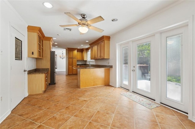 120 Pine Dr, Covington, LA 70433 - kitchen with dark countertops, freestanding refrigerator, recessed lighting, a peninsula, and a ceiling fan