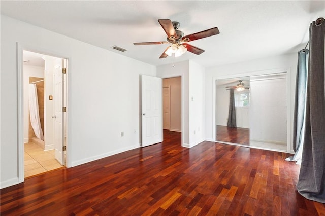 120 Pine Dr, Covington, LA 70433 - unfurnished bedroom with wood finished floors, baseboards, and a ceiling fan