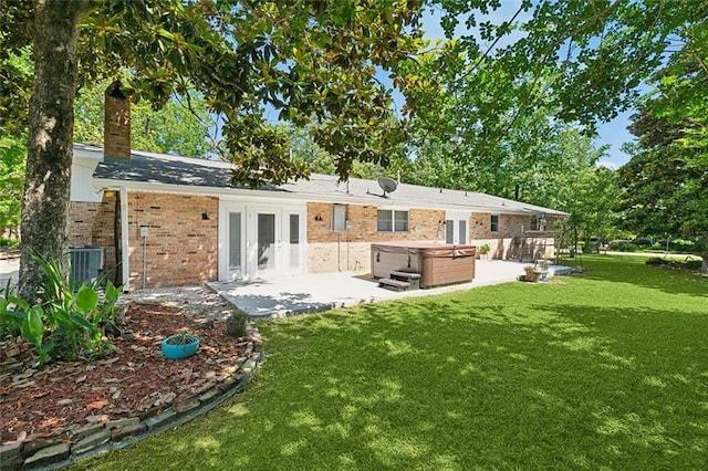 120 Pine Dr, Covington, LA 70433 - rear view of house featuring a hot tub, french doors, a patio, and a yard