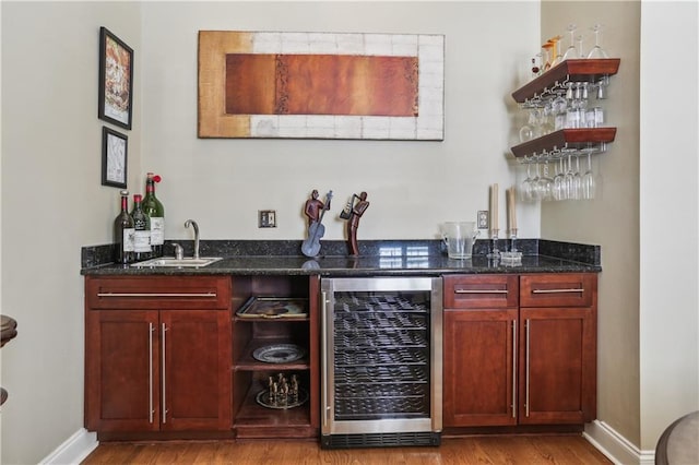 760 Magazine St Ph, Ph, New Orleans, LA 70130 - indoor wet bar featuring beverage cooler, wood finished floors, and baseboards