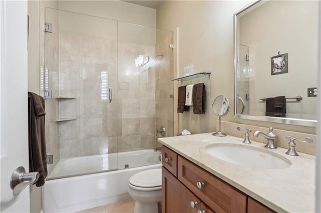 760 Magazine St Ph, Ph, New Orleans, LA 70130 - bathroom featuring toilet, vanity, enclosed tub / shower combo, and tile patterned flooring