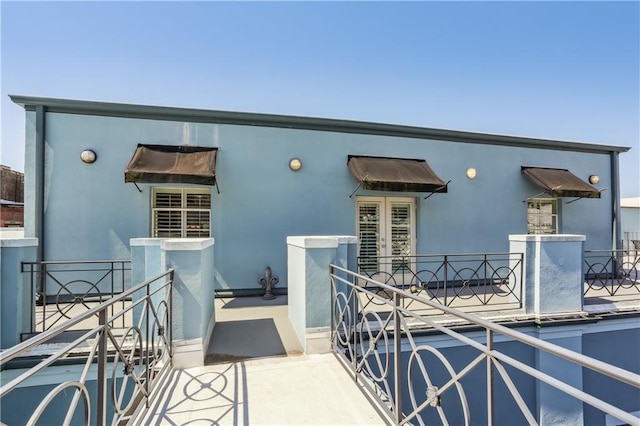 760 Magazine St Ph, Ph, New Orleans, LA 70130 - view of front facade featuring stucco siding