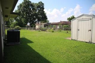 116 Southern Ct, Avondale, LA 70094 - view of yard featuring a storage shed, an outdoor structure, and central air condition unit