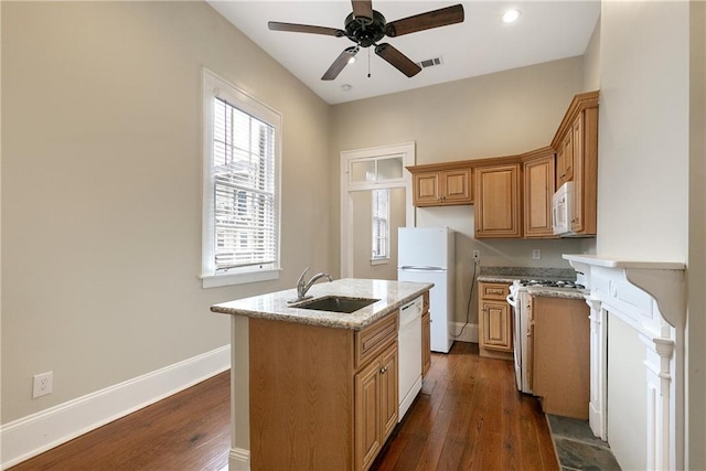 211315 S Liberty St, New Orleans, LA 70113 - kitchen with white appliances, a sink, dark wood-type flooring, a kitchen island with sink, and a ceiling fan
