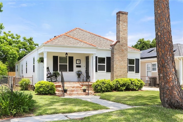 18 Davis Blvd, Jefferson, LA 70121 - view of front of home with covered porch and a chimney