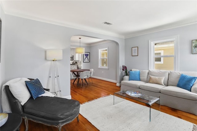 18 Davis Blvd, Jefferson, LA 70121 - living area featuring arched walkways, wood finished floors, crown molding, and baseboards
