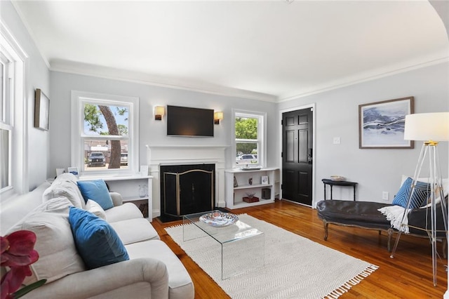 18 Davis Blvd, Jefferson, LA 70121 - living room featuring plenty of natural light, ornamental molding, a fireplace with flush hearth, and wood finished floors