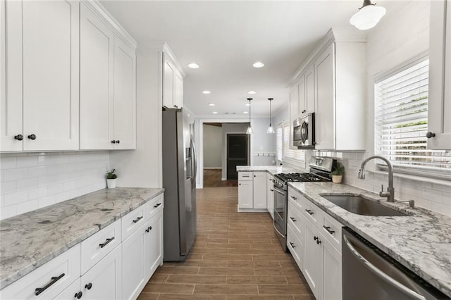 18 Davis Blvd, Jefferson, LA 70121 - kitchen with appliances with stainless steel finishes, a sink, white cabinets, backsplash, and recessed lighting