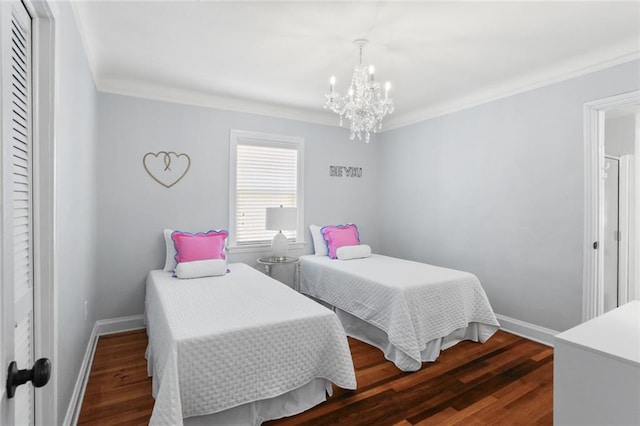 18 Davis Blvd, Jefferson, LA 70121 - bedroom with a chandelier, ornamental molding, dark wood-style flooring, and baseboards