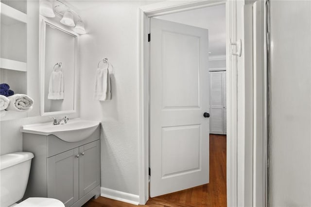 18 Davis Blvd, Jefferson, LA 70121 - half bath featuring wood finished floors, vanity, and toilet