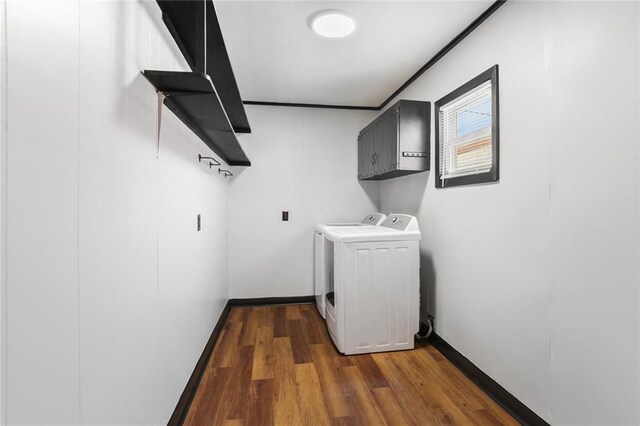 18 Davis Blvd, Jefferson, LA 70121 - washroom featuring separate washer and dryer, cabinet space, dark wood-type flooring, and baseboards