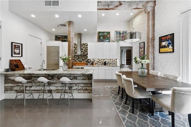 840 Tchoupitoulas St Unit 215, New Orleans, LA 70130 - dining area with finished concrete flooring and recessed lighting