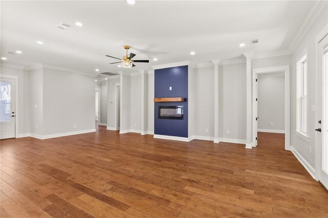 1109 David Dr, Metairie, LA 70003 - unfurnished living room with recessed lighting, wood finished floors, ceiling fan, ornamental molding, and baseboards