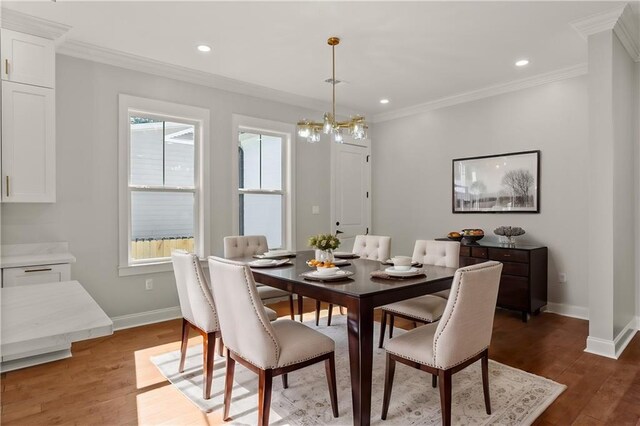 1109 David Dr, Metairie, LA 70003 - dining room with baseboards, crown molding, plenty of natural light, wood finished floors, and recessed lighting