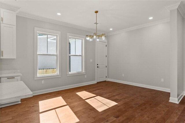 1109 David Dr, Metairie, LA 70003 - unfurnished dining area with crown molding, baseboards, a chandelier, dark wood-style flooring, and recessed lighting