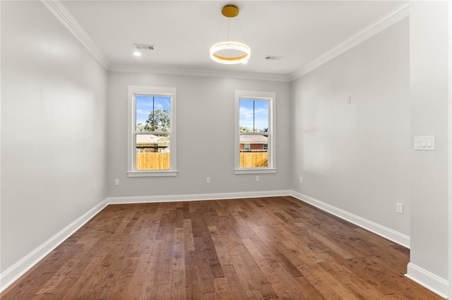 1109 David Dr, Metairie, LA 70003 - spare room featuring dark wood finished floors, ornamental molding, and baseboards