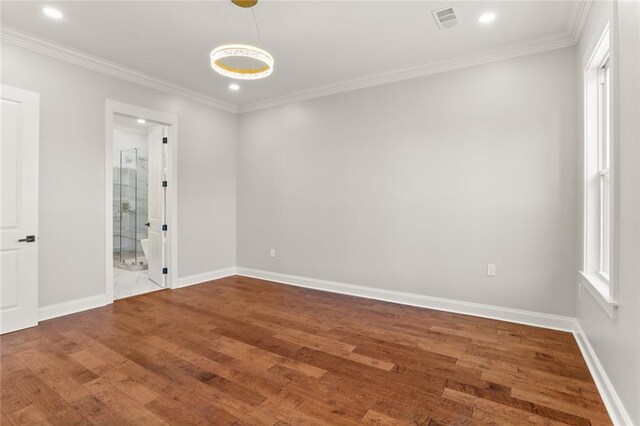 1109 David Dr, Metairie, LA 70003 - empty room featuring wood finished floors, ornamental molding, baseboards, and recessed lighting