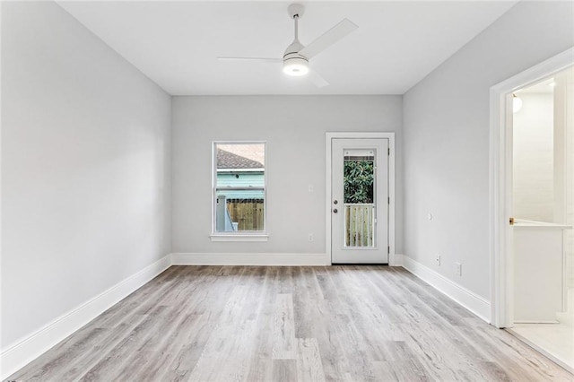 310507 Toulouse St, New Orleans, LA 70119 - empty room with light wood-style flooring and a ceiling fan