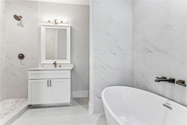 310507 Toulouse St, New Orleans, LA 70119 - bathroom featuring vanity, a freestanding tub, marble finish flooring, and a tile shower