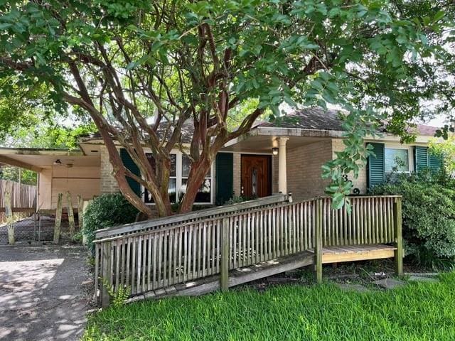 1329 Sigur Ave, Metairie, LA 70005 - rear view of house with fence and brick siding