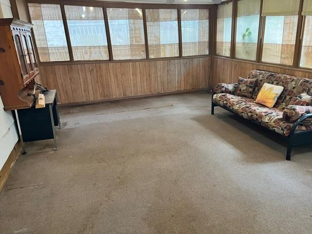 1329 Sigur Ave, Metairie, LA 70005 - sunroom / solarium featuring carpet flooring, healthy amount of natural light, and wood walls