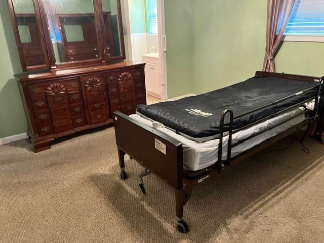 1329 Sigur Ave, Metairie, LA 70005 - bedroom with light carpet and baseboards