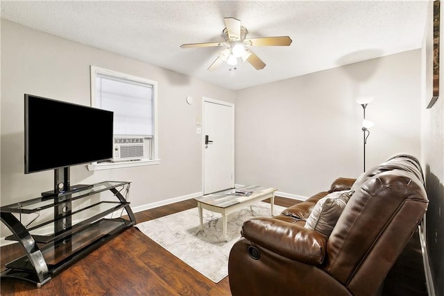 1031 Henriette Delille St Unit 2, New Orleans, LA 70116 - living room with ceiling fan, wood finished floors, cooling unit, baseboards, and a textured ceiling
