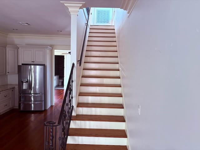 913 N Robertson St, New Orleans, LA 70116 - staircase with wood finished floors and ornamental molding