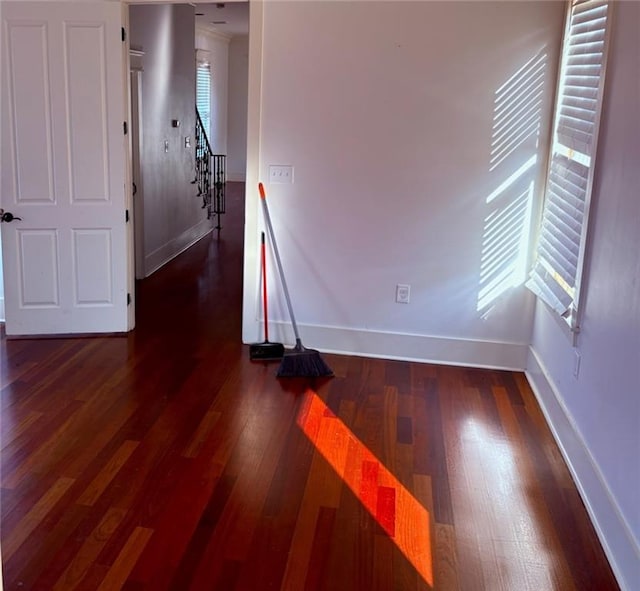 913 N Robertson St, New Orleans, LA 70116 - empty room with baseboards, wood finished floors, and stairway