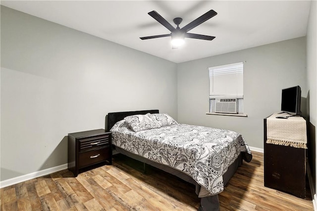 1031 Henriette Delille St Unit 4, New Orleans, LA 70116 - bedroom with baseboards, light wood-type flooring, and cooling unit