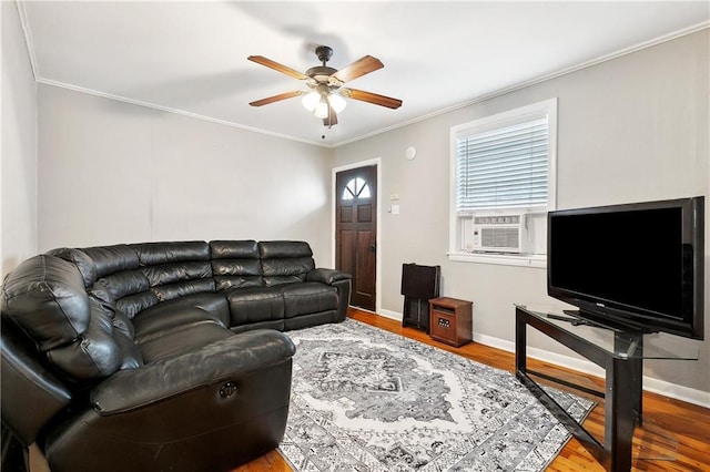 1031 Henriette Delille St Unit 7, New Orleans, LA 70116 - living area with ornamental molding, a ceiling fan, baseboards, wood finished floors, and cooling unit