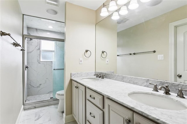 9108 Ormond Pl, River Ridge, LA 70123 - bathroom featuring marble finish flooring, a marble finish shower, baseboards, toilet, and double vanity