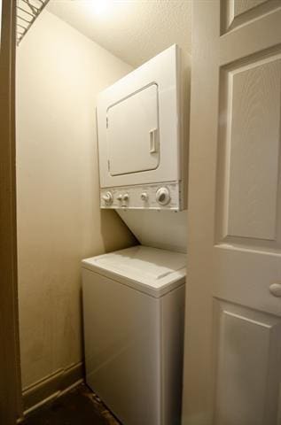 350 Atalin St Unit 11A, Mandeville, LA 70448 - laundry room featuring stacked washer and clothes dryer