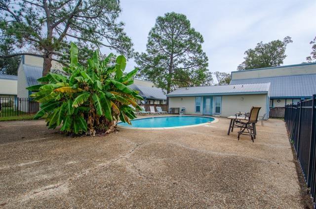 350 Atalin St Unit 11A, Mandeville, LA 70448 - view of pool featuring a fenced backyard and a patio