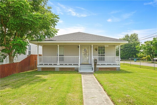 1401 Claiborne Dr, Jefferson, LA 70121 - bungalow-style home with a porch and roof with shingles