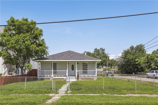 1401 Claiborne Dr, Jefferson, LA 70121 - bungalow with a porch, a gate, and roof with shingles