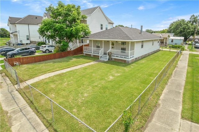 1401 Claiborne Dr, Jefferson, LA 70121 - back of property with covered porch and roof with shingles